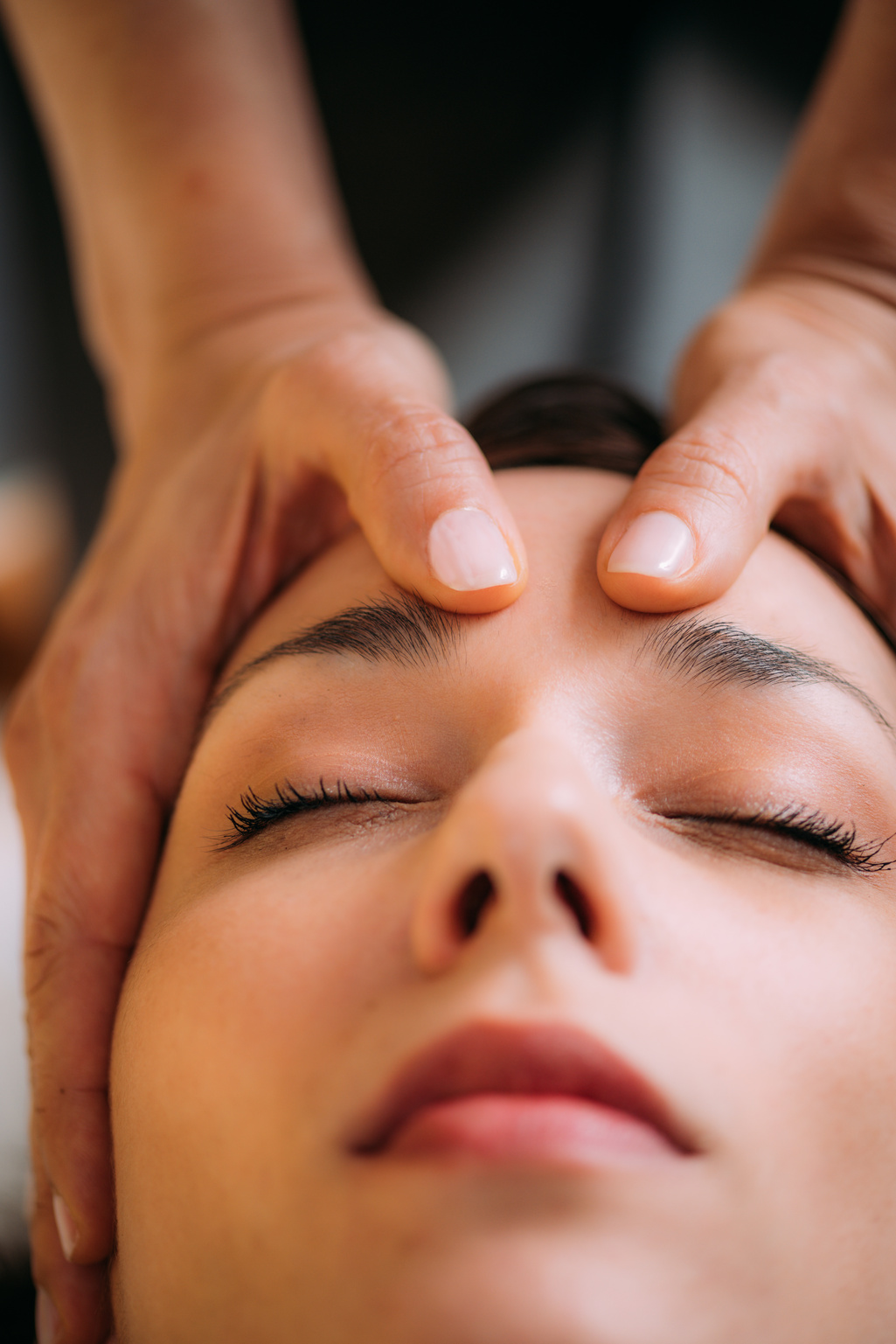 CST therapist Massaging Woman’s Head. Craniosacral Therapy Massage.